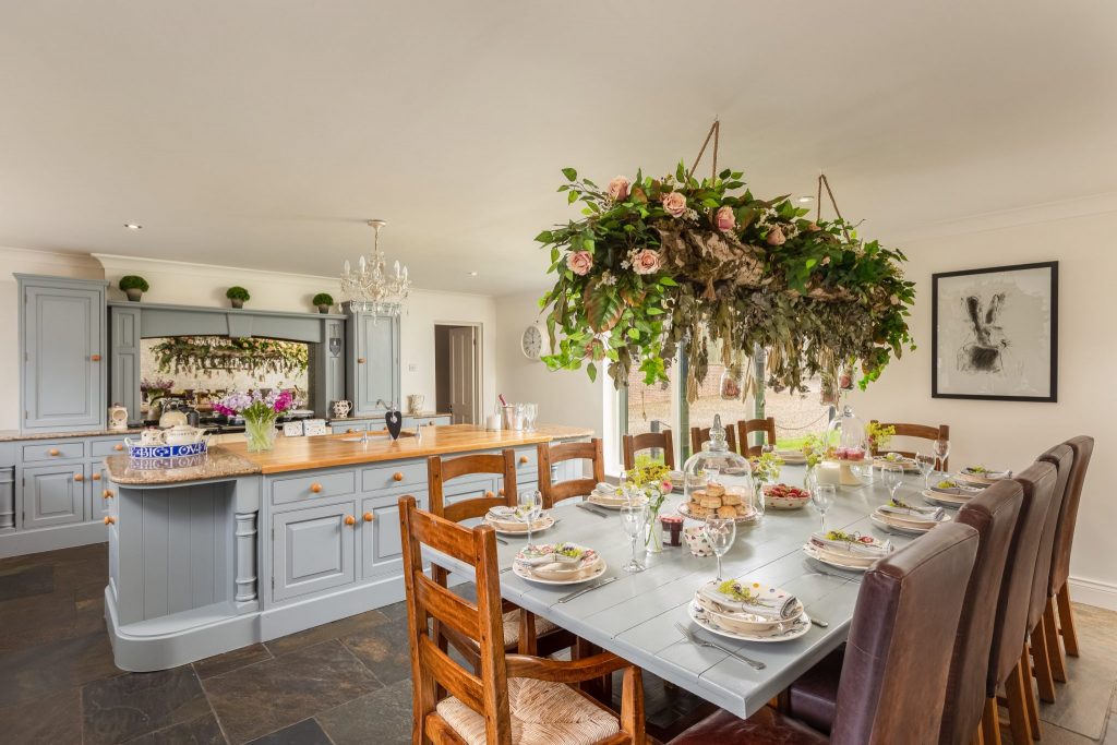 Farmhouse kitchen with cream Aga and copper pans
